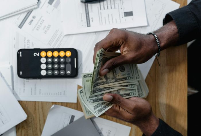 Business owner reviewing plans and costs for a commercial roof replacement project